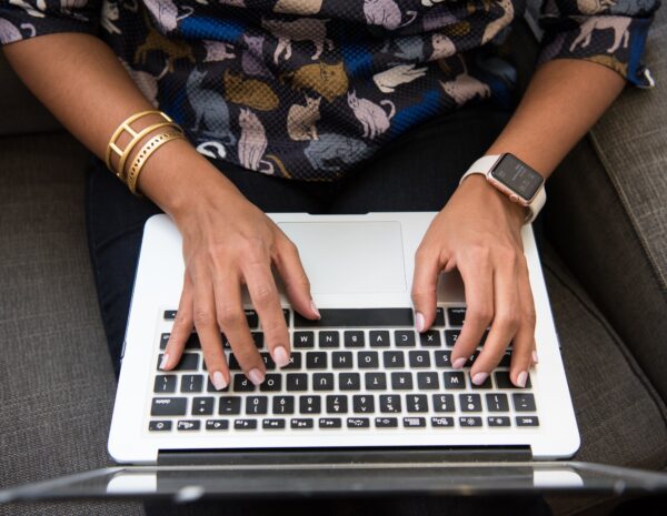 Woman typing on computer.