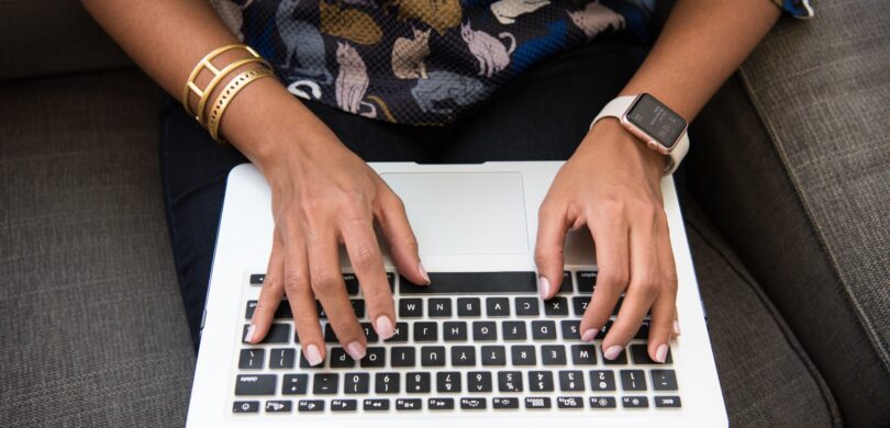 Woman typing on computer.